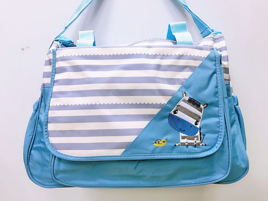 Bolso maternal + Mudador cebra celeste